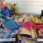 the studio with my palette of hand stained papers spread around me as I work.